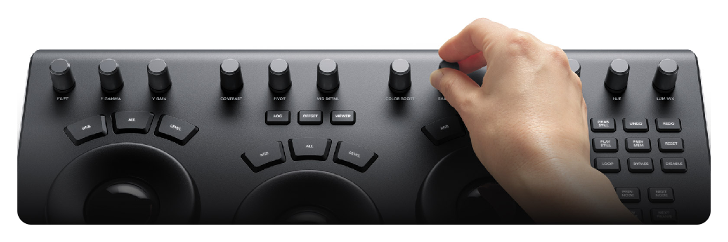 hand adjusting the controls of the DaVinci Resolve Micro Panel, Blackmagic Design DaVinci Resolve Micro Panel